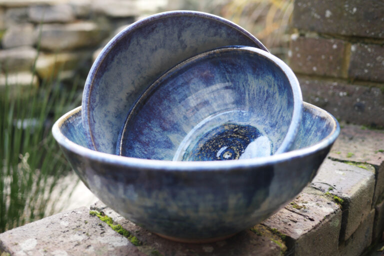 group of large rutile and mottled blue glazed bowls